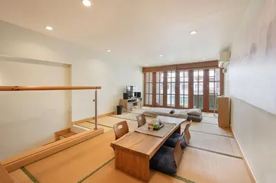 a living room with a table and a couch at Bangkok Japanese designed 3BR Home Ekkamai BTS in Bangkok