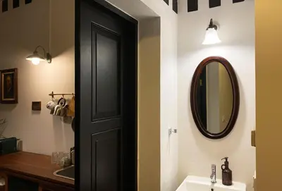 a bathroom with a black door and a sink at Stylist Siamese Design House Steps To Chinatown - Self Check In in Bangkok