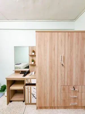 an office with a wooden desk and a sliding door at 808-STP Homely room Free Wi-Fi and Near BTS in Sathani Bang Khen