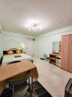 a bedroom with a bed and a tv and a table at 808-STP Homely room Free Wi-Fi and Near BTS in Sathani Bang Khen