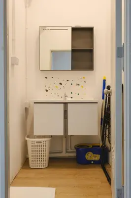 a bathroom with a sink and a mirror at 2 BR Sleeps6 I City Center Silom in Bangkok