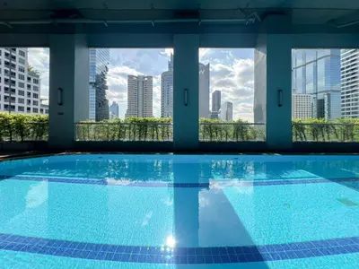 a swimming pool with a view of the city at Stylish 2BR City View - BTS St.Louis - Ultra Fast Wifi in Bangkok