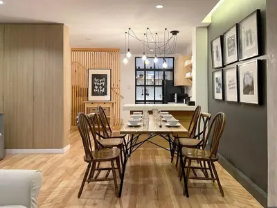 a dining room and kitchen with a table and chairs at Vélin - Samsen in Bangkok