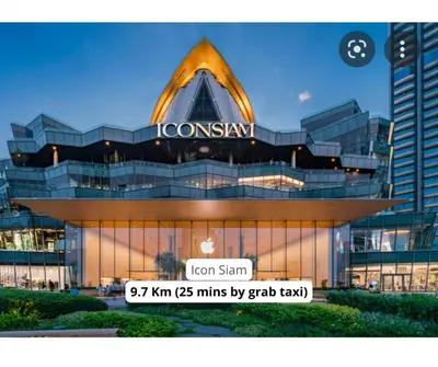 a building with a sign on the front of it at Vélin - Samsen in Bangkok