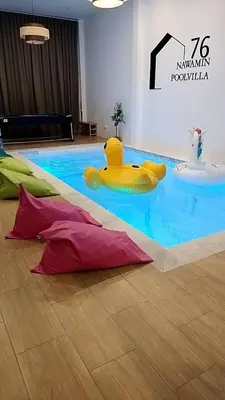a yellow rubber duck in the middle of a swimming pool at นวมินทร์ 76 พูลวิลล่า - Nawamin 76 Poolwilla in Ban Baen Phichit