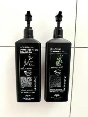 two black shampoo bottles sitting next to each other at I LOVE BANGKOK - Thai Style Room near Skytrain Asok, T21, and EM District Malls in Bangkok