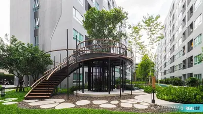 a spiral staircase in front of a building at Resort Style room Ellio Monthly Available in Bangkok
