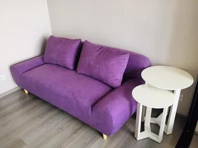 a purple couch in a living room with a white table at Great facilities n River view n Local in Ban Sai Ma