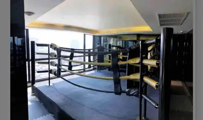 a gym with lots of boxing equipment at Great facilities n River view n Local in Ban Sai Ma