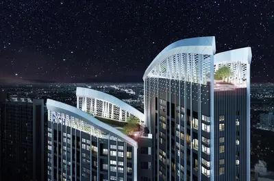 a rendering of two tall buildings at night at The Rich Rama 9 Luxury Condos in Sathani Ban Hua Mak