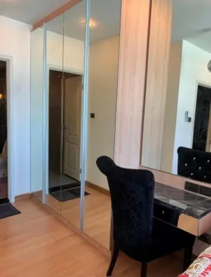a room with a mirror and a black chair at Supalai Wellington 2, near MRT in Sathani Khlong Tan