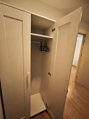 a closet with a white door and a wooden floor at BTS sukhumvit Line onnut station in Bangkok