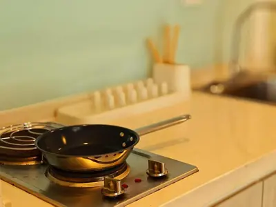a frying pan on top of a stove in a kitchen at BTS sukhumvit Line onnut station in Bangkok