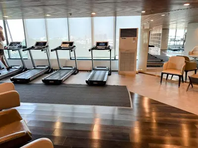 a gym with several treadmills in a building at Artisan Ratchada Huge 1BR Condos in Bangkok