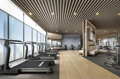 a gym with a row of treadmills and machines at Artisan Ratchada Huge 1BR Condos in Bangkok