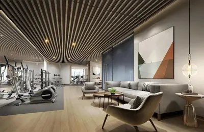 a living room with a couch and a gym at Artisan Ratchada Spacious 2BR Condos in Bangkok