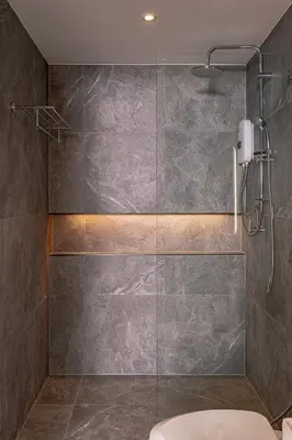 a bathroom with a glass shower with a toilet at The Lodge Bangkok Poolvilla in Sathani Khlong Tan