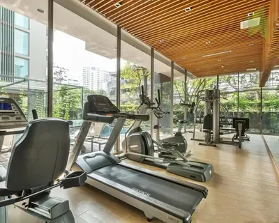 a gym with cardio equipment in a building at 2 Bed 2 Bath Phrom Phong BTS in Bangkok