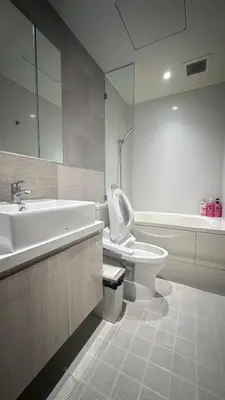 a bathroom with a sink and a toilet and a tub at Paradise condo-perfect location in Bangkok