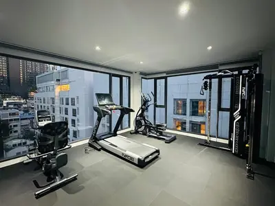 an apartment gym with a view of a city at 6th Avenue Sukhumvit BKK 301 BTS Asoke Nana MRT in Bangkok
