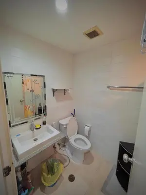 a bathroom with a toilet and a sink at Condo with Pool View & Great Amenities Bangkok in Sathani Ban Hua Mak