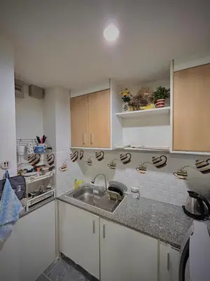 a kitchen with a sink and a counter top at Condo with Pool View & Great Amenities Bangkok in Sathani Ban Hua Mak