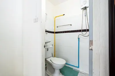 a bathroom with a toilet and a shower at XX Oh My Nap- Sukhumvit Soi 3 BTS Nana in Bangkok