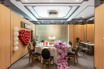 a dining room with a table and balloons at Rama9 No1 Hotel in Bangkok