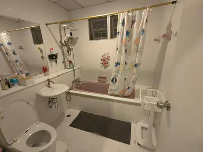a bathroom with a toilet and a sink and a tub at Privacy House in Ban Bang Phai