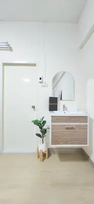 a bathroom with a sink and a potted plant at New room DMKairport,BTS, impact 340 in Ban Song Hong