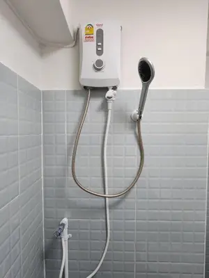 a shower in a bathroom with a blow dryer at new room near Don Mueang airport,Impact,BTS 339 in Ban Song Hong