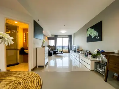 a large room with a kitchen and a living room at Luxurious 2BR Ultra Fast Wifi Phrom Phong in Bangkok