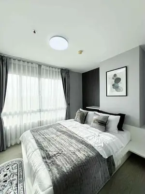 a bedroom with a large bed and a window at Prime Near Sathorn Sukhumvit Central in Chong Nonsi