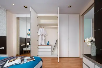 a bedroom with a closet and a bed at King suite with kitchen-Short walk to Park,BTS,Mall in Khlong Toei