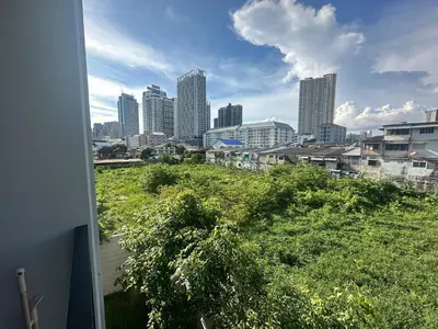 a view of a city skyline with tall buildings at Brand new Condo near ICON SIAM in Bangkok