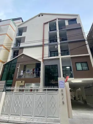 a building with a fence in front of it at NIJ Lady dorm in Bangkok