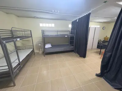 a room with two bunk beds in a room at NIJ Lady dorm in Bangkok