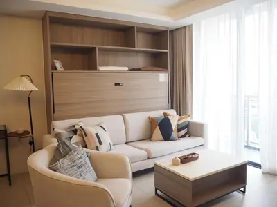 a living room with a white couch and a table at Circle Sukhumvit31 Bangkok #2BR #5ppl in Bangkok