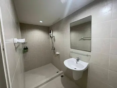 a bathroom with a sink and a mirror at Loft at sanambinnam in Ban Bang Talat
