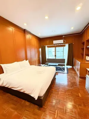 a bedroom with a large bed and a living room at xx Stay On Sukhumvit Soi 11 BTS Nana - สเตย์ออน สุขุมวิท 11 รถไฟฟ้านานา in Makkasan