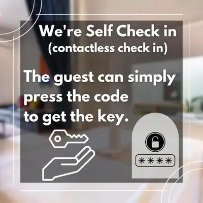a sign that says were self check in contactless check in at xx GO INN Khaosan Bangkok - โกอินน์ ถนนข้าวสาร in Bang Bua Thong Railway Station