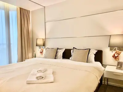 a hotel room with a bed with towels on it at Sathorn Prime Residence 1BR #Bangkok in Bangkok
