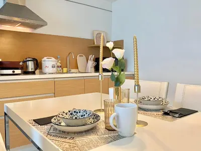 a kitchen with a table with two dishes on it at Sathorn Prime Residence 1BR #Bangkok in Bangkok