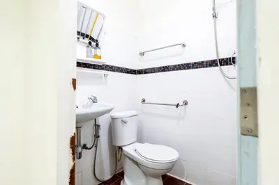 a bathroom with a toilet and a sink at XX Oh My Nap - BTS Nana โอ้ มาย แนป ซอยนานา in Bangkok