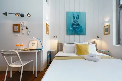 a bedroom with two beds and a desk with a computer at Non Inn The Diamond Artisan and Barber 4 Bedroom Riverside Retreat with King and Twin Rooms in Bang Rak