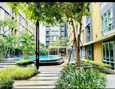 a courtyard with a swimming pool in a building at Welcome to warm room here have gym saona Netflix in Bangkok