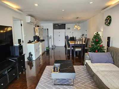 a living room with a christmas tree in it at Kuma House Sukhumvit in Bangkok