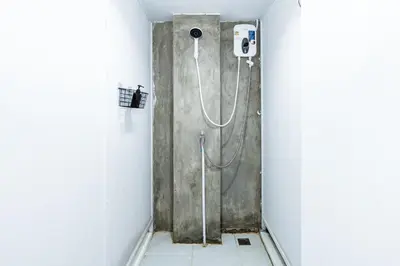a shower stall in a bathroom with a shower at xx เดอะ ฮิดเด้น ตรอก ข้าวสาร The Hidden Khaosan in Bangkok