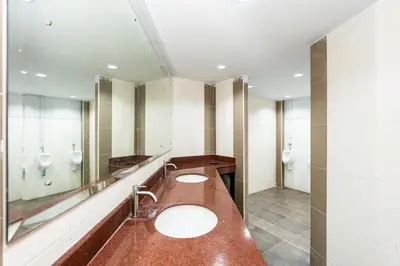 two sinks in a bathroom with two mirrors at xx เดอะ ฮิดเด้น ตรอก ข้าวสาร The Hidden Khaosan in Bangkok