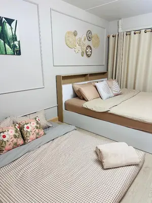 two beds in a room with two mattresses at MoonStay C1 Impact Arena Muangthongthani-Donmuang-FreeSpeedWifi in Nonthaburi